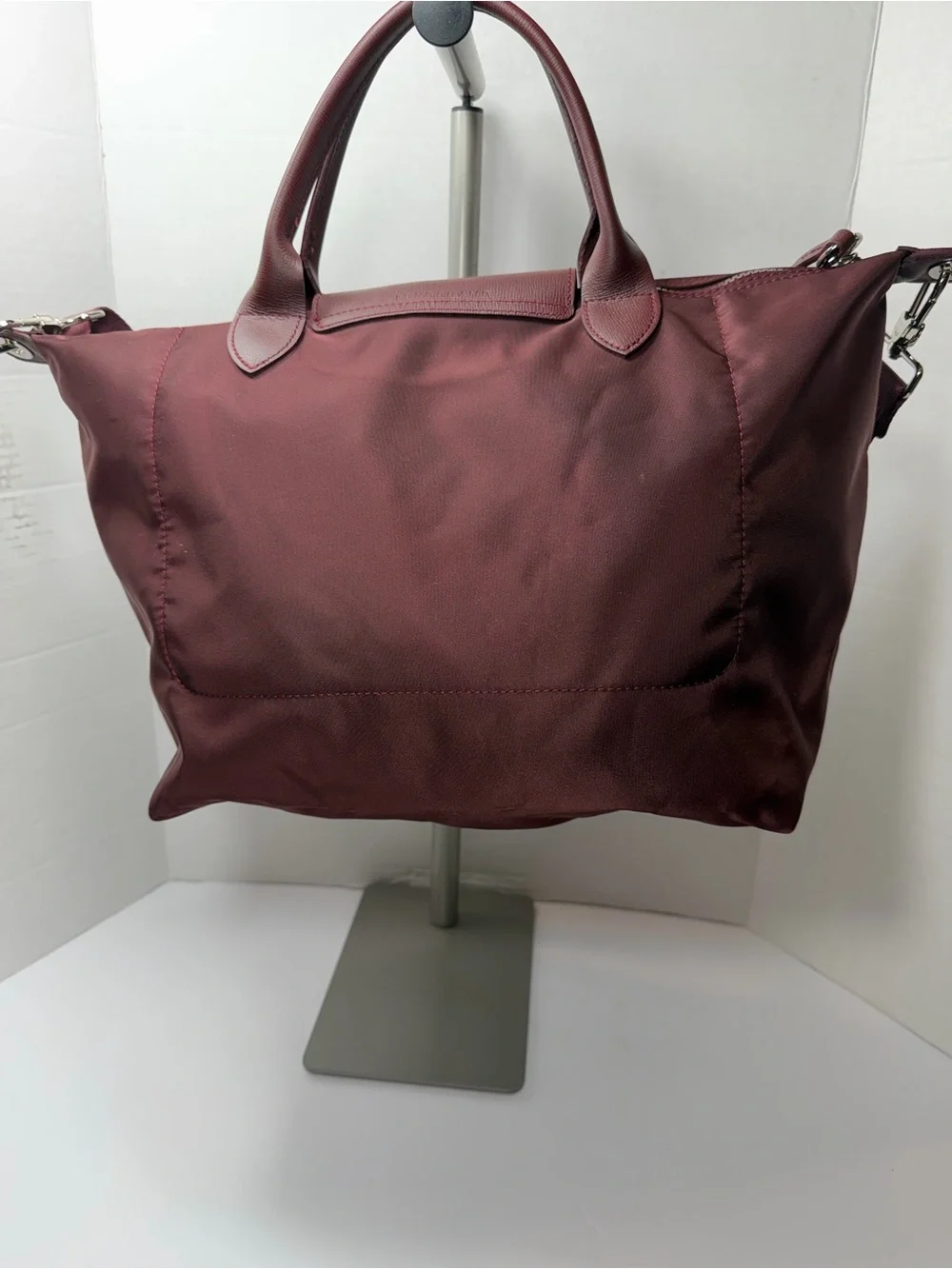LONGCHAMP Burgundy medium Le Pliage tote from LONGCHAMP featuring leather trim